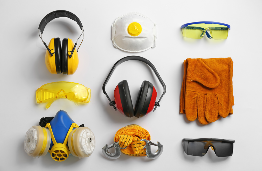 A photo of common workplace safety equipment, including hearing and breathing protection, goggles and gloves