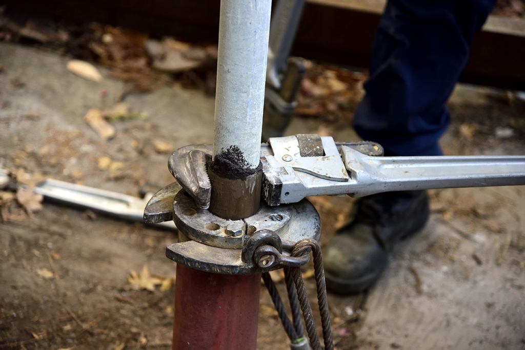 Using a pipe wrench on well tubing