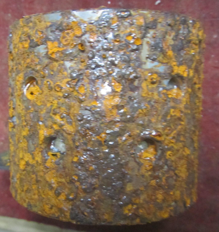 Corrosion on an uncoated lower cone sleeve