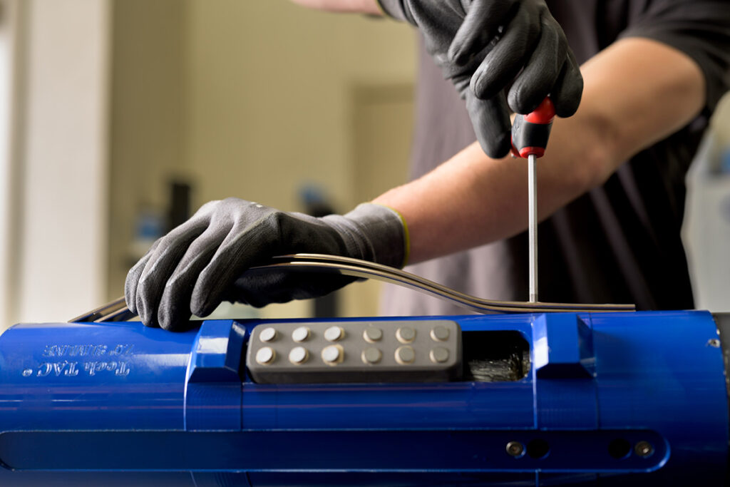 Assembling a tubing anchor at TechTAC, a family-owned business