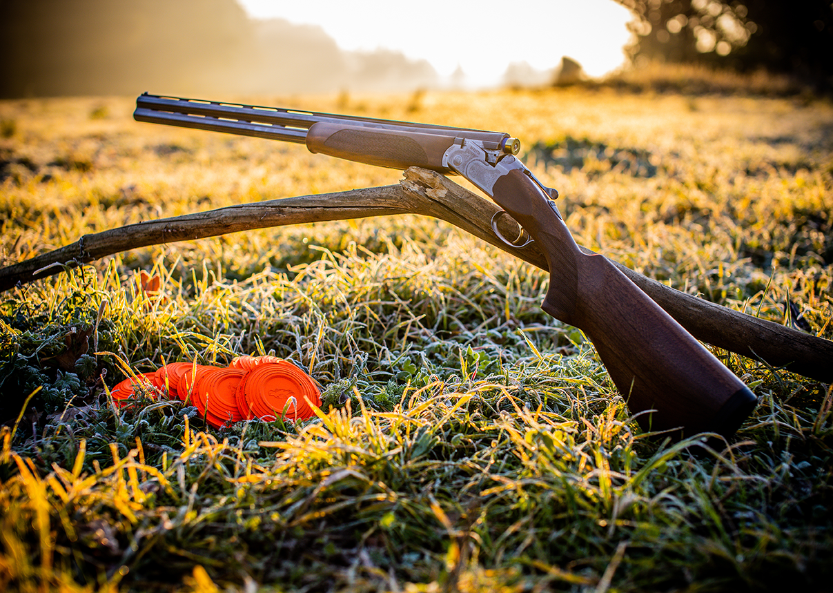 A shotgun and clay birds
