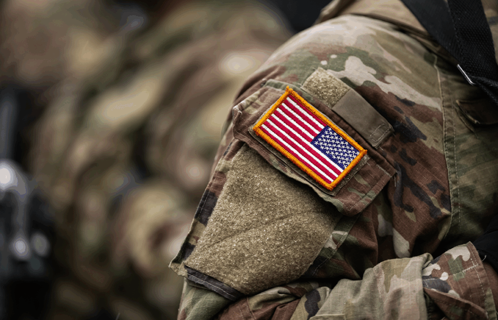 The American flag patch on the uniform of a U.S. service member