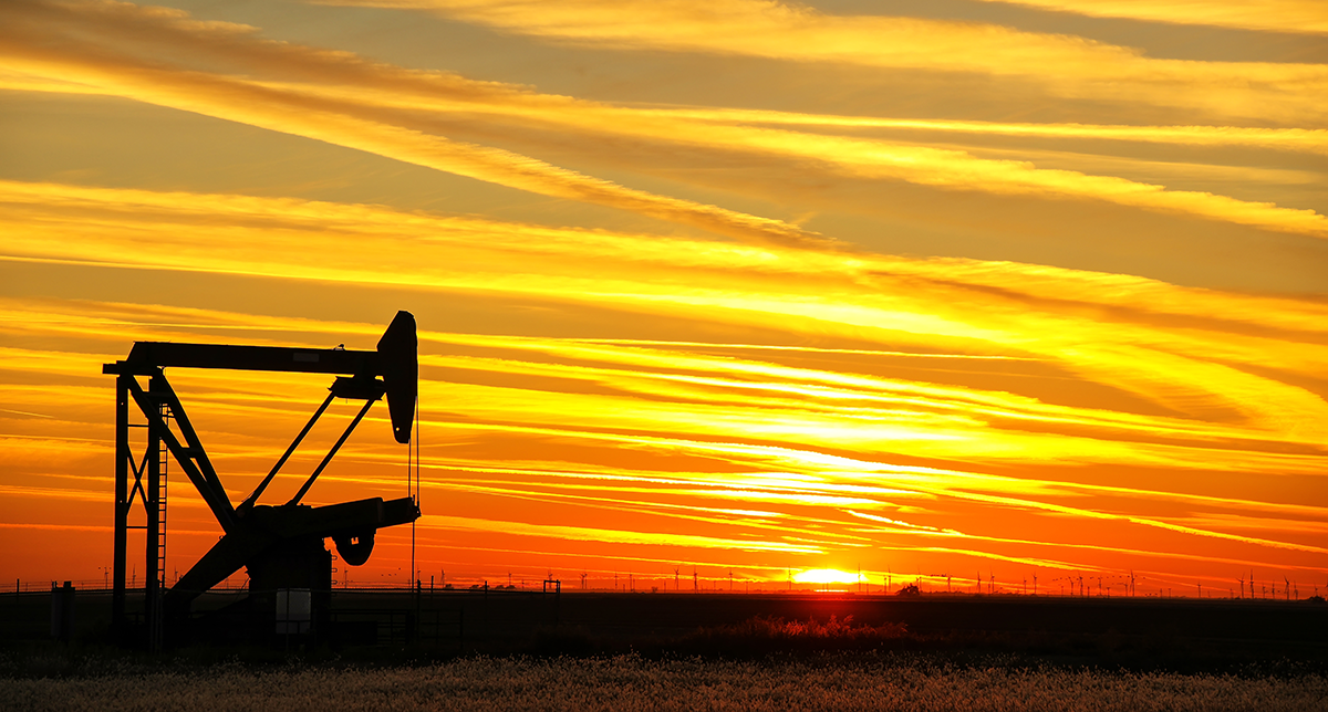 A sucker rod pump at sunset