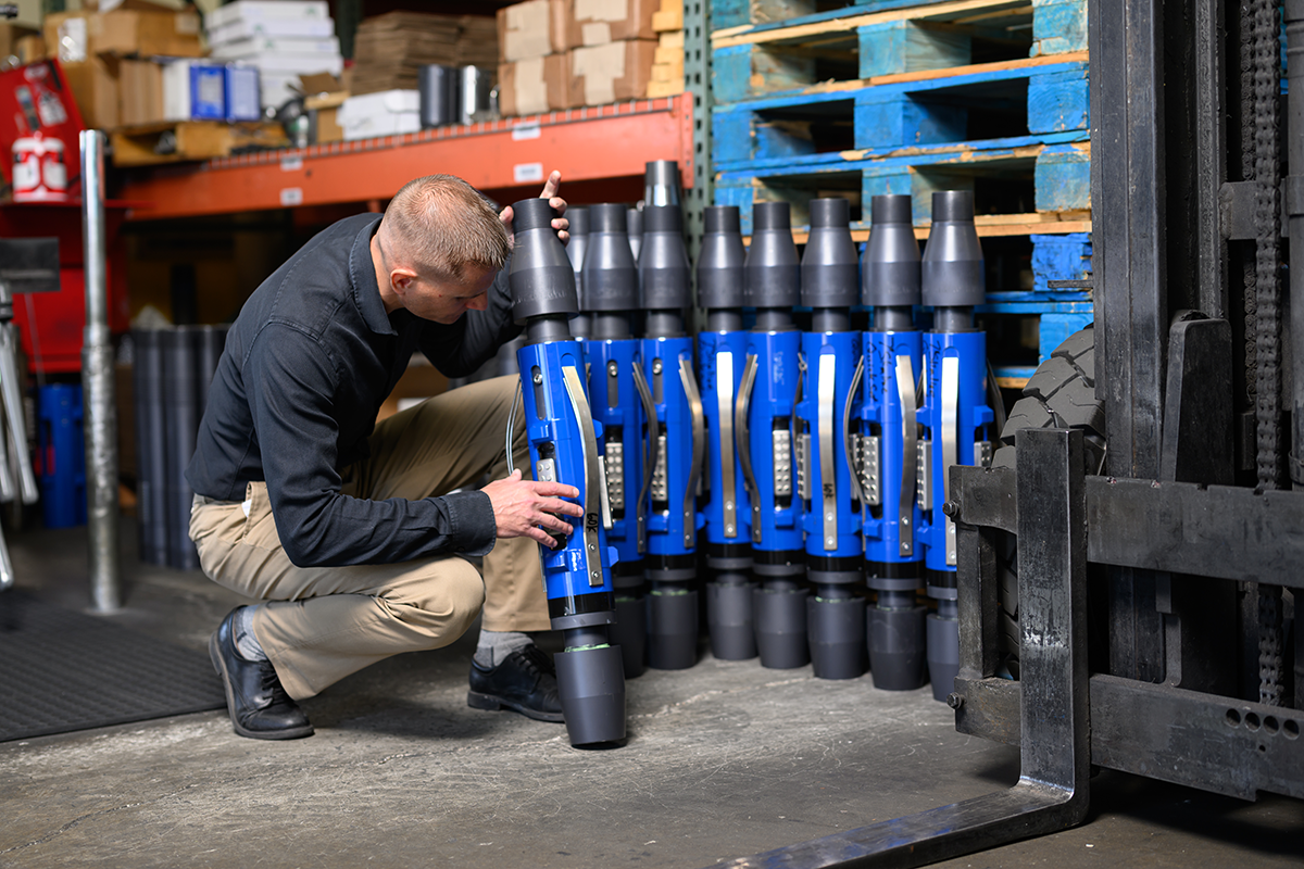 A man inspecting a tubing anchor catcher